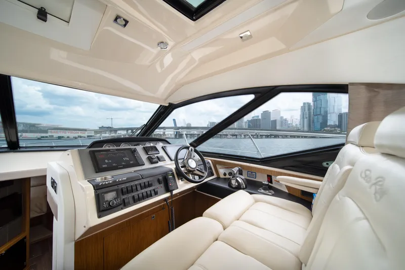 Slide: The Image of Luxurious 2017 Sea Ray Sundancer 510 yacht interior with city skyline view. - 22