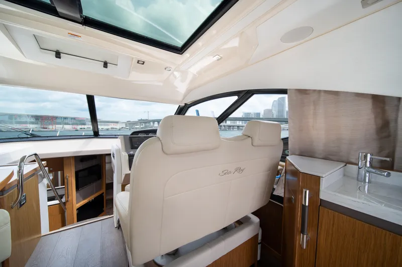 Slide: The Image of Luxurious interior of 2017 Sea Ray Sundancer 510 yacht with modern helm and seating. - 23