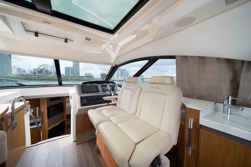 Slide: The Image of Interior of 2017 Sea Ray Sundancer 510 yacht with luxurious seating and modern helm. - 24