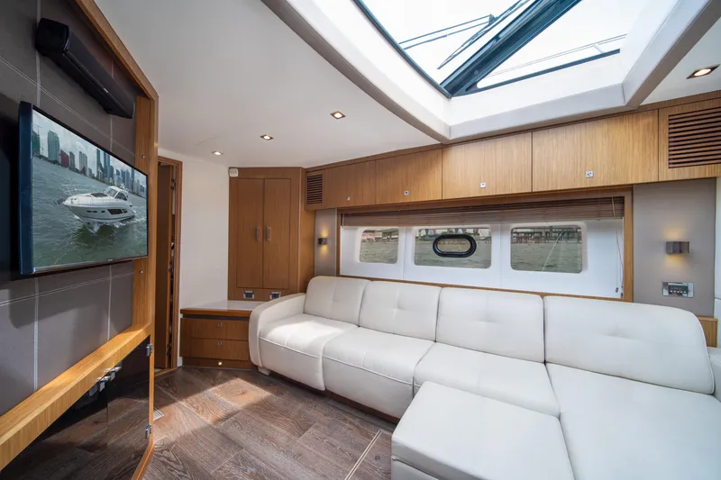Slide: The Image of Luxurious interior of 2017 Sea Ray Sundancer 510 yacht with modern furnishings and skylight. - 26