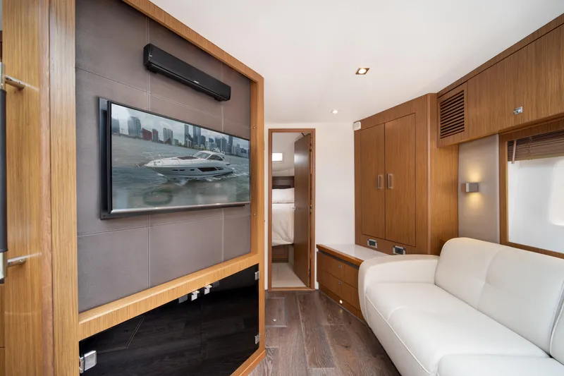 Slide: The Image of Luxurious interior of 2017 Sea Ray Sundancer 510 yacht with modern furnishings and TV. - 27
