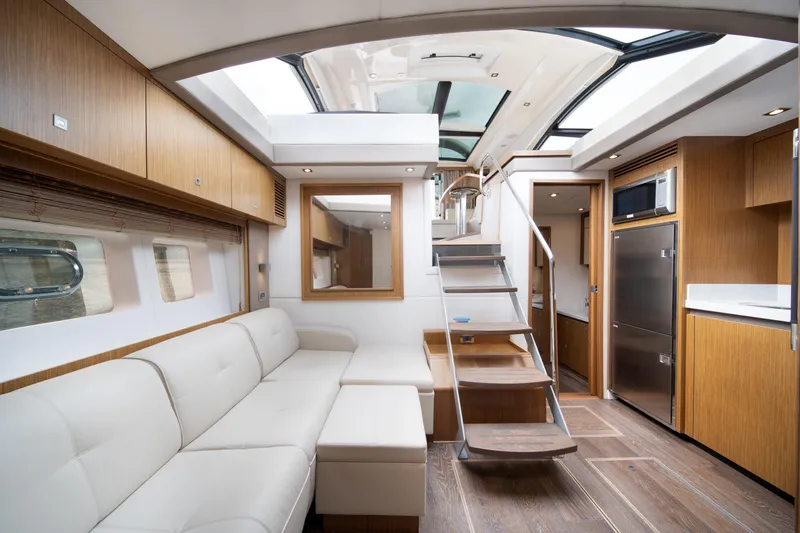 Slide: The Image of Luxurious interior of 2017 Sea Ray Sundancer 510 yacht with modern design and spacious seating. - 29