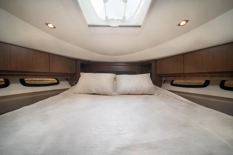 Slide: The Image of Luxurious cabin interior of 2017 Sea Ray Sundancer 510 yacht with skylight and plush bedding. - 32