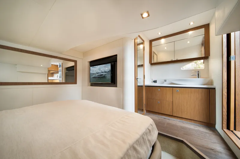 Slide: The Image of Luxurious interior of 2017 Sea Ray Sundancer 510 yacht with modern bedroom and bathroom. - 36