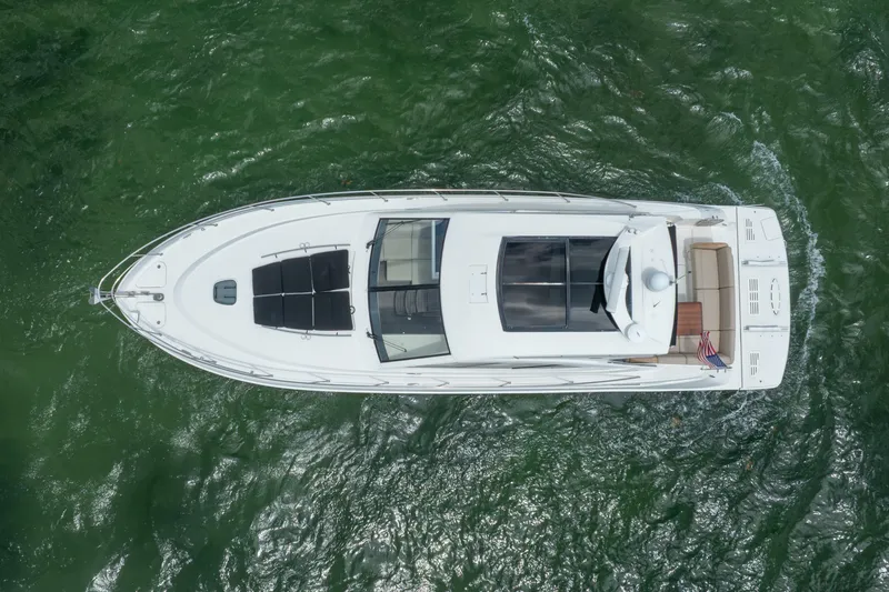 Slide: The Image of Aerial view of 2017 Sea Ray Sundancer 510 yacht on green water. - 7