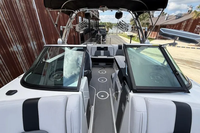 Slide: The Image of 2019 MasterCraft X22 boat interior with sleek seating and modern design. - 14
