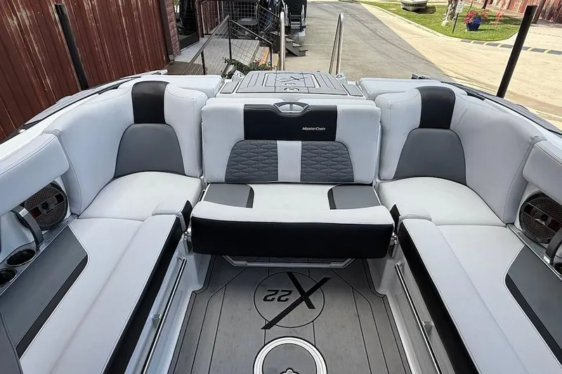 Slide: The Image of 2019 MasterCraft X22 boat interior with luxurious seating and modern design. - 15