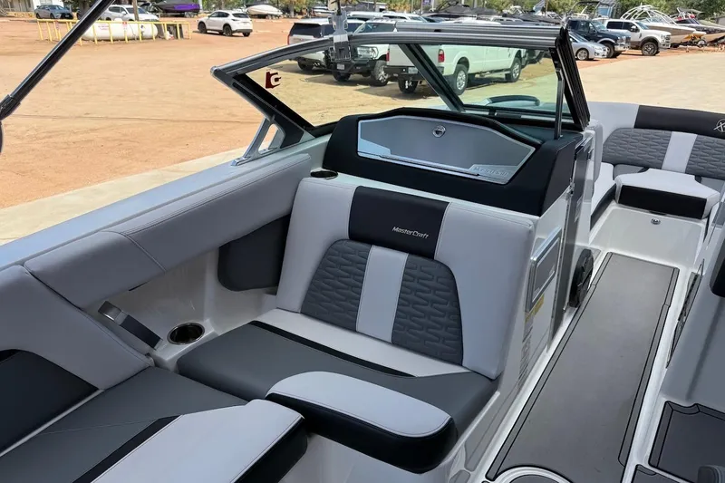 Slide: The Image of 2019 MasterCraft X22 boat interior with sleek seating and modern design. - 5