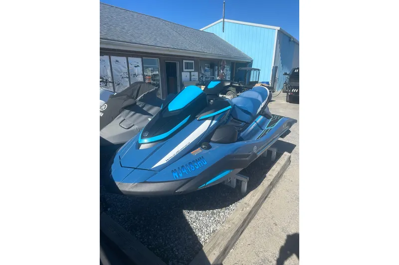 Slide: The Image of 2024 Yamaha WaveRunner FX Cruiser HO in blue, parked outdoors on gravel. - 10