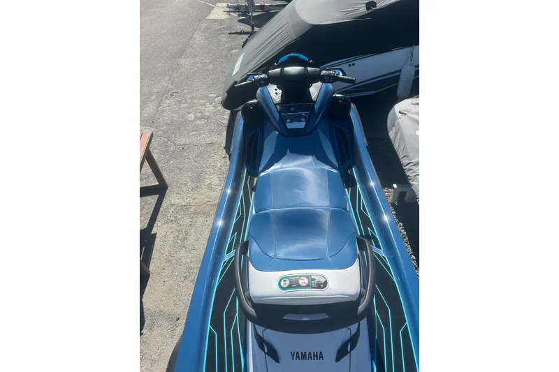 Slide: The Image of 2024 Yamaha WaveRunner FX Cruiser HO in blue, parked outdoors. - 3