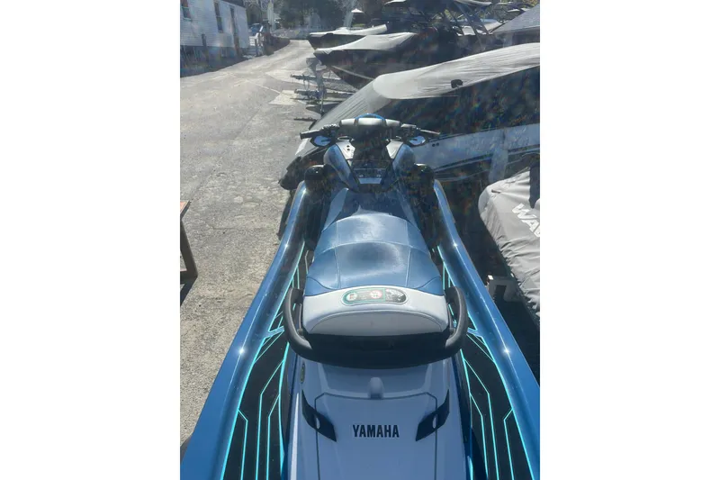 Slide: The Image of 2024 Yamaha WaveRunner FX Cruiser HO in a marina setting, showcasing sleek design. - 4