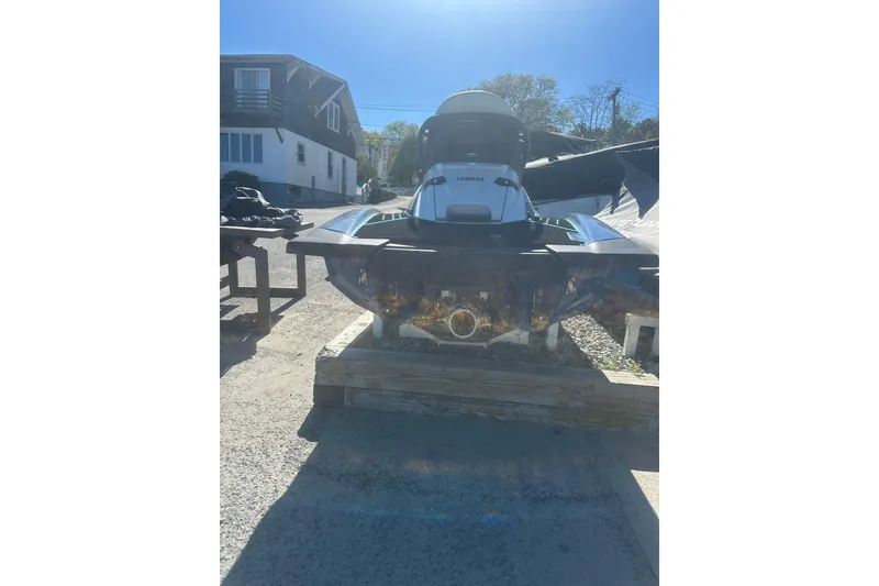 Slide: The Image of 2024 Yamaha WaveRunner FX Cruiser HO on a dock under clear blue sky. - 5