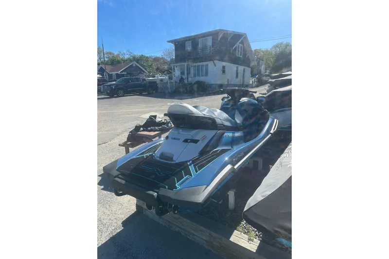 Slide: The Image of 2024 Yamaha WaveRunner FX Cruiser HO parked outdoors on a sunny day. - 6