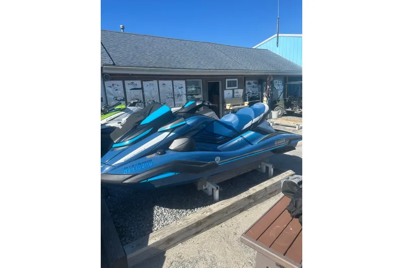 Slide: The Image of 2024 Yamaha WaveRunner FX Cruiser HO in blue, parked outside a building. - 9
