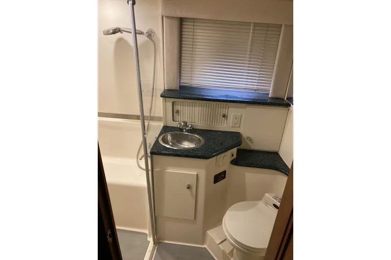 Slide: The Image of Bathroom interior of 2001 Carver 356 Motor Yacht with shower, sink, and toilet. - 12