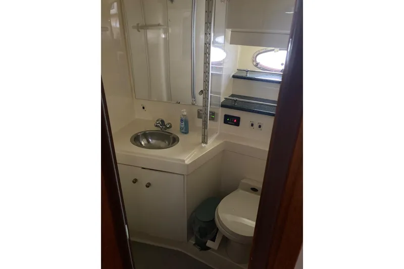 Slide: The Image of Bathroom interior of 2001 Carver 356 Motor Yacht with sink and toilet. - 13