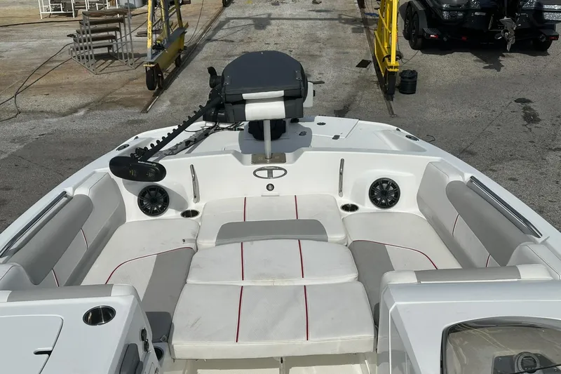 Slide: The Image of 2021 Tahoe 2150 boat interior with cushioned seating and modern design. - 16