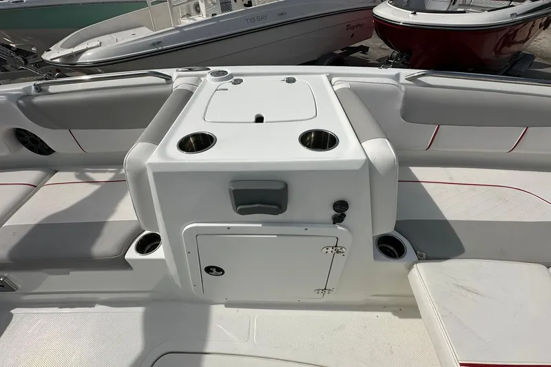 Slide: The Image of 2021 Tahoe 2150 boat interior with seating and cup holders. - 9