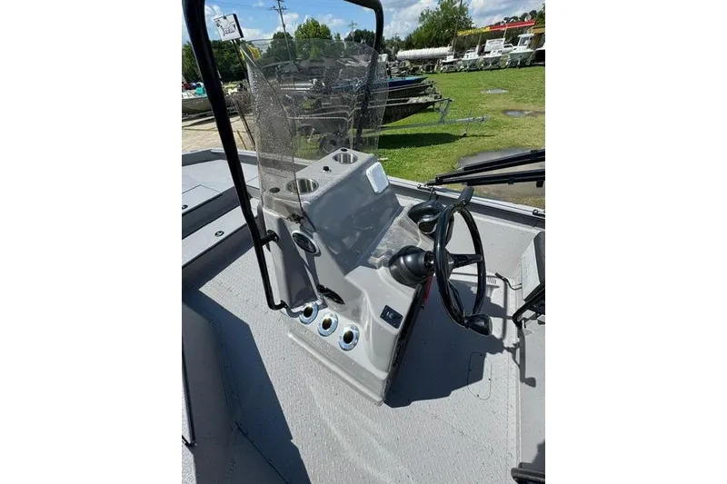 Slide: The Image of 2026 SeaArk Bay Runner 210 boat console with steering wheel and controls. - 10