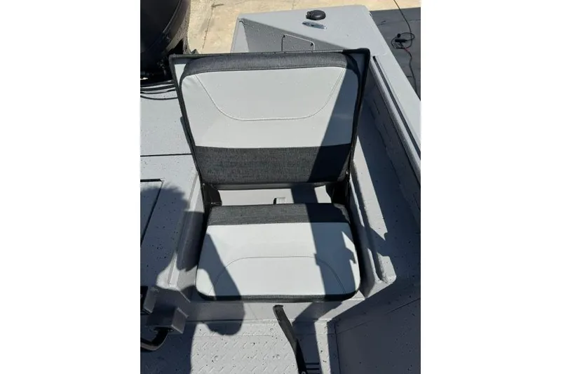 Slide: The Image of 2026 SeaArk Bay Runner 210 boat seat, featuring a sleek gray and black design. - 13