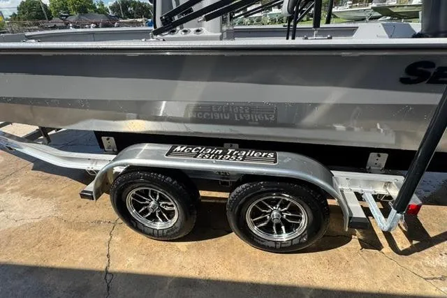 Slide: The Image of 2026 SeaArk Bay Runner 210 on McClain trailer, parked outdoors. - 3