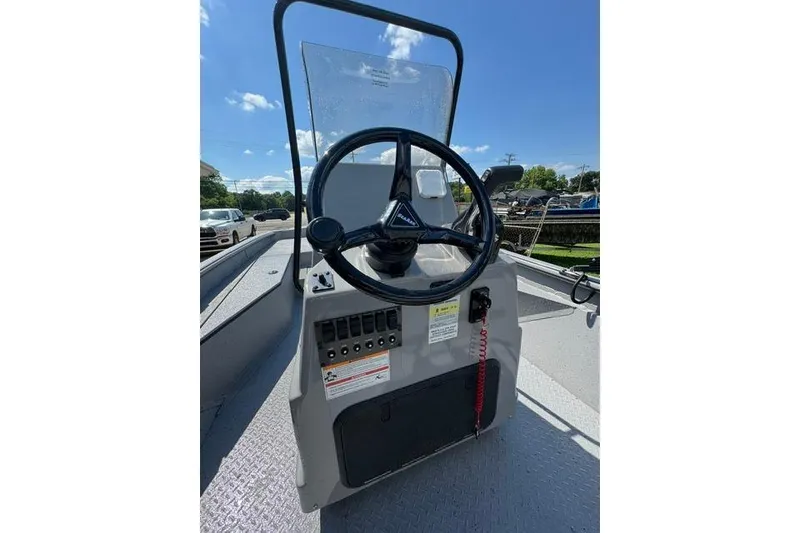 Slide: The Image of 2026 SeaArk Bay Runner 210 boat console with steering wheel and control panel. - 9