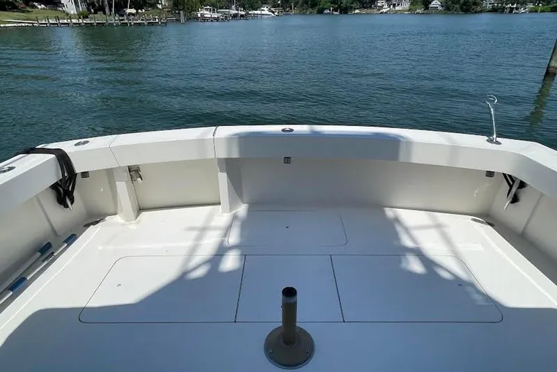 Slide: The Image of Spacious deck of 1990 Viking 53 Convertible yacht overlooking serene waters. - 14