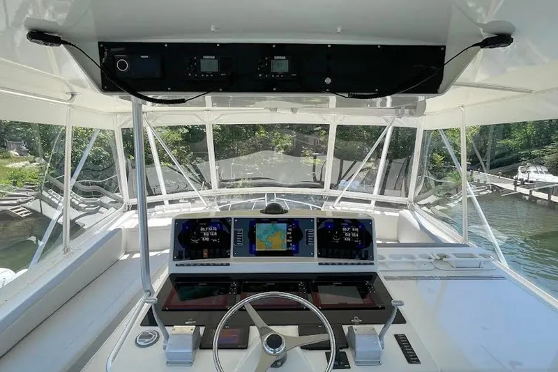 Slide: The Image of Cockpit view of a 1990 Viking 53 Convertible yacht with advanced navigation systems. - 17