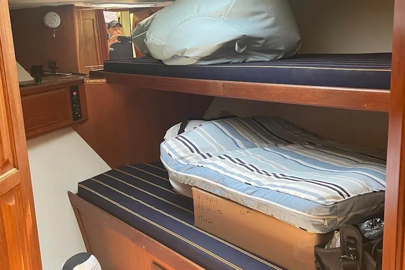 Slide: The Image of Cozy cabin interior of 1990 Viking 53 Convertible yacht with bunk beds. - 37