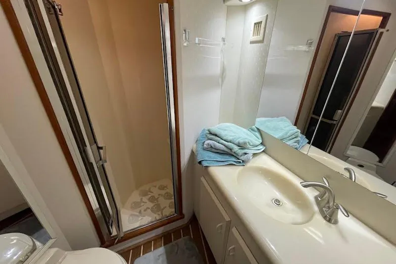 Slide: The Image of Bathroom interior of 1990 Viking 53 Convertible yacht with shower and sink. - 44