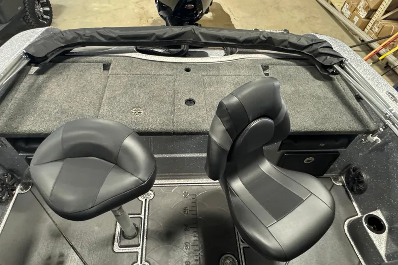 Slide: The Image of 2026 Nitro ZV19 Sport Pro boat interior with two black seats and carpeted deck. - 10