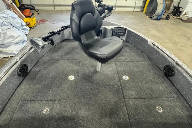 Slide: The Image of 2026 Nitro ZV19 Sport Pro boat interior with swivel seat and carpeted deck. - 12