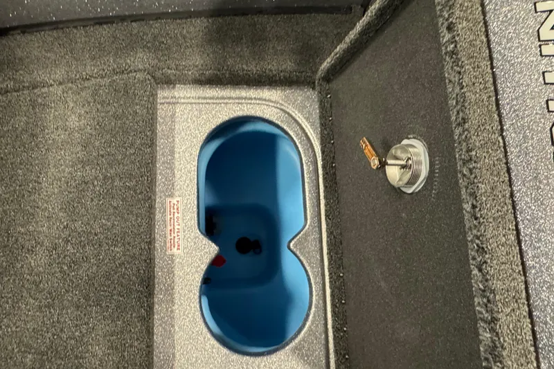 Slide: The Image of Livewell compartment in 2026 Nitro ZV19 Sport Pro boat, featuring blue interior and secure latch. - 18