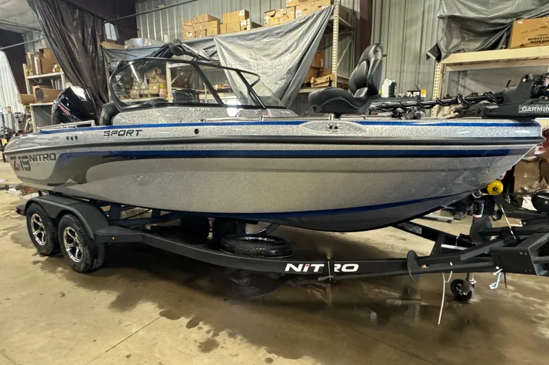 Slide: The Image of 2026 Nitro ZV19 Sport Pro boat in a warehouse, on a trailer, ready for adventure. - 2