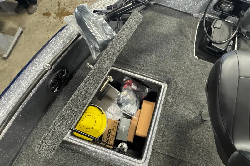 Slide: The Image of Storage compartment of 2026 Nitro ZV19 Sport Pro boat with various equipment and accessories. - 20