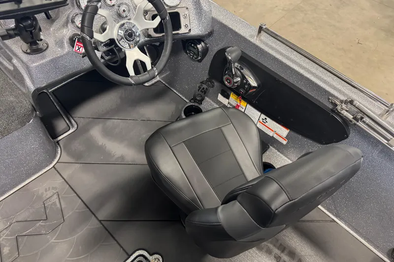 Slide: The Image of Interior of 2026 Nitro ZV19 Sport Pro boat, featuring steering wheel and captain's seat. - 5