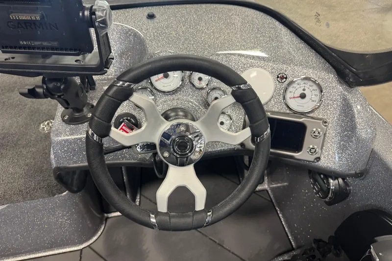 Slide: The Image of 2026 Nitro ZV19 Sport Pro dashboard with steering wheel and Garmin device. - 7