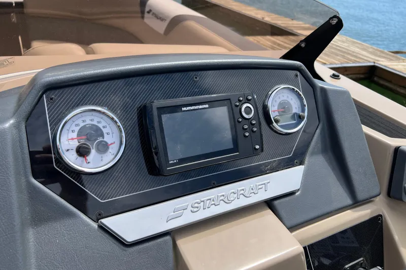 Slide: The Image of Dashboard of 2026 Starcraft SLS 3 R boat with gauges and navigation system. - 10