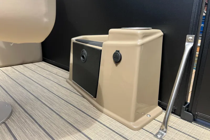 Slide: The Image of Interior detail of 2026 Starcraft SLS 3 R boat, featuring a beige storage compartment. - 15