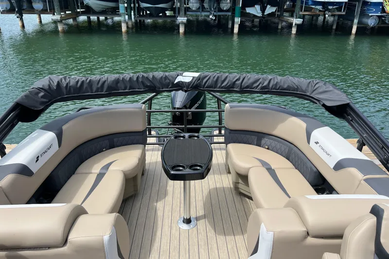 Slide: The Image of Luxury seating on 2026 Starcraft SLS 3 R boat, docked by the water. - 16