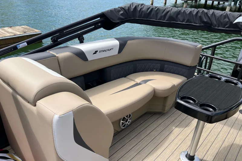 Slide: The Image of Luxurious seating on 2026 Starcraft SLS 3 R pontoon boat with sleek design and cup holders. - 17