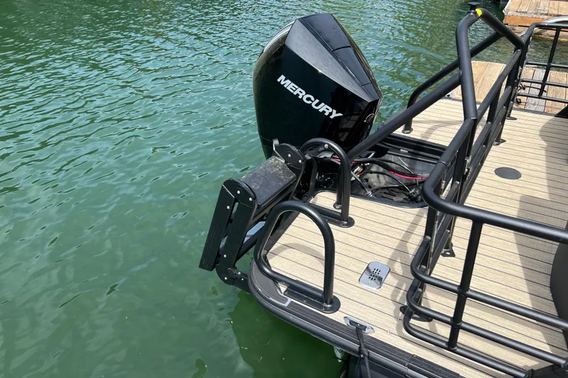 Slide: The Image of 2026 Starcraft SLS 3 R boat with Mercury outboard motor on water. - 18
