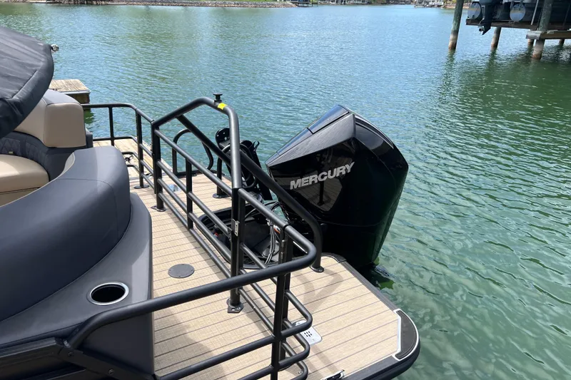 Slide: The Image of 2026 Starcraft SLS 3 R boat with Mercury outboard motor on calm water. - 4