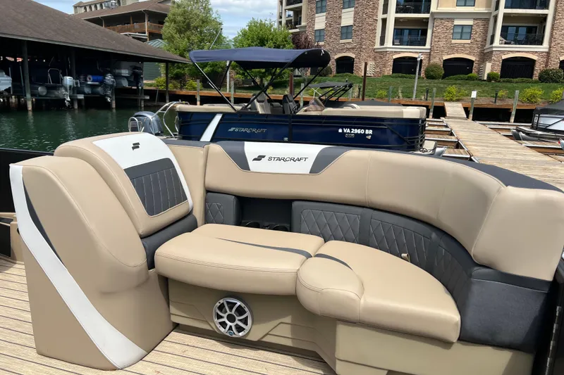 Slide: The Image of Luxurious seating on a 2026 Starcraft SLS 3 R boat docked at a marina. - 7