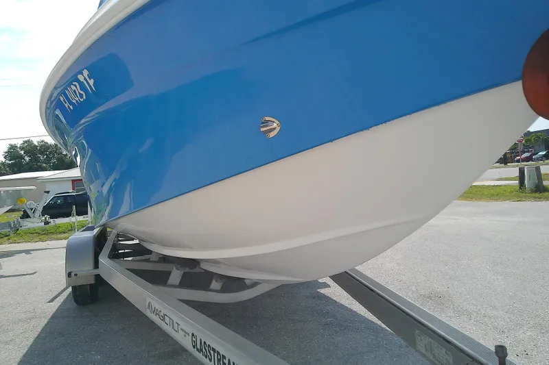 Slide: The Image of 2022 Glasstream 280 Pro-XS boat on trailer, blue and white hull. - 10