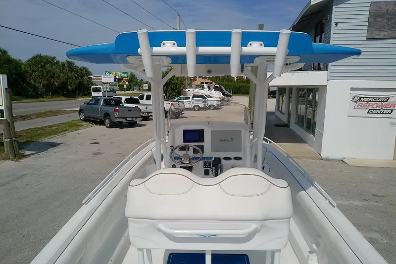 Slide: The Image of 2022 Glasstream 280 Pro-XS boat with blue canopy and Garmin navigation system. - 13