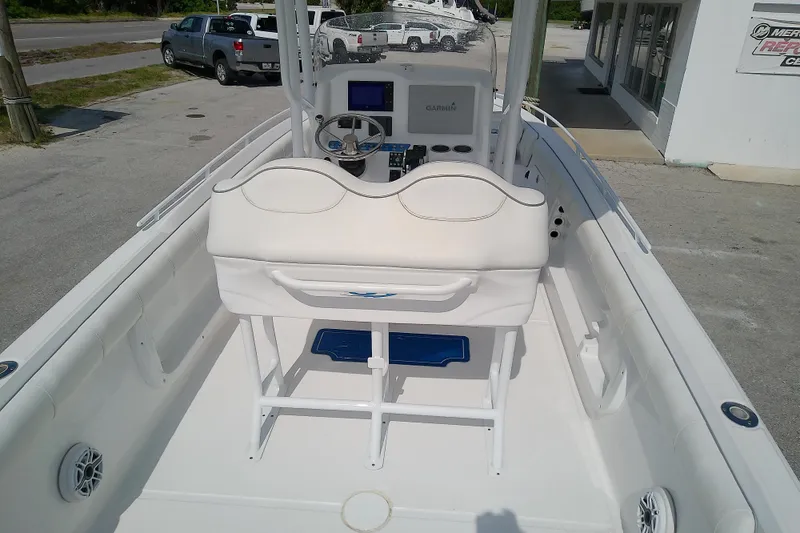 Slide: The Image of 2022 Glasstream 280 Pro-XS boat interior with helm, seating, and navigation equipment. - 14