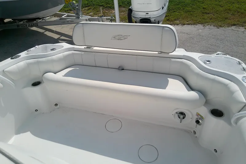 Slide: The Image of 2022 Glasstream 280 Pro-XS boat interior with white seating and cup holders. - 16