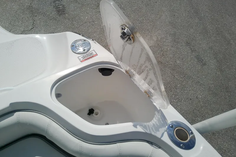Slide: The Image of 2022 Glasstream 280 Pro-XS boat compartment with open hatch and visible fittings. - 17