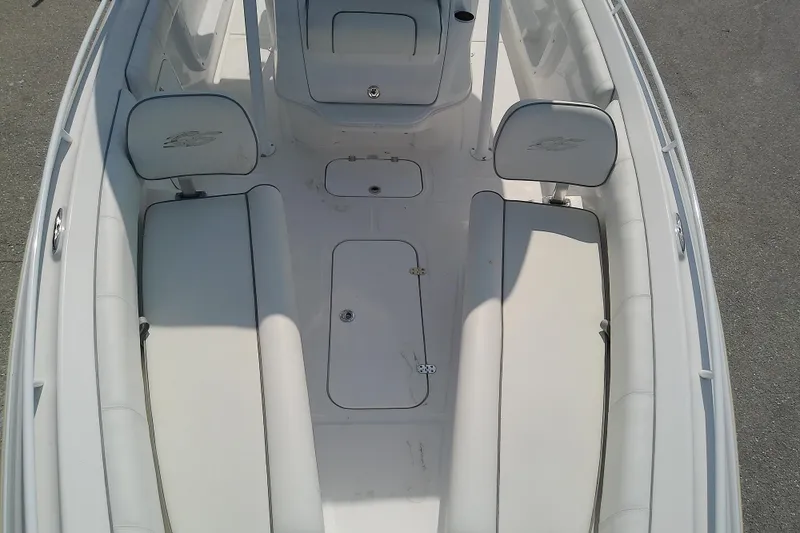 Slide: The Image of 2022 Glasstream 280 Pro-XS boat interior with white seating and storage compartments. - 20